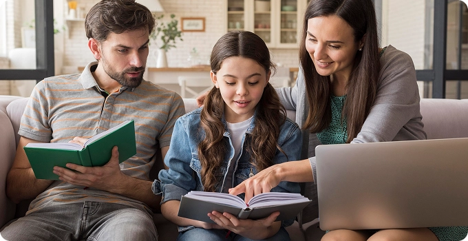 parents teaching girl read